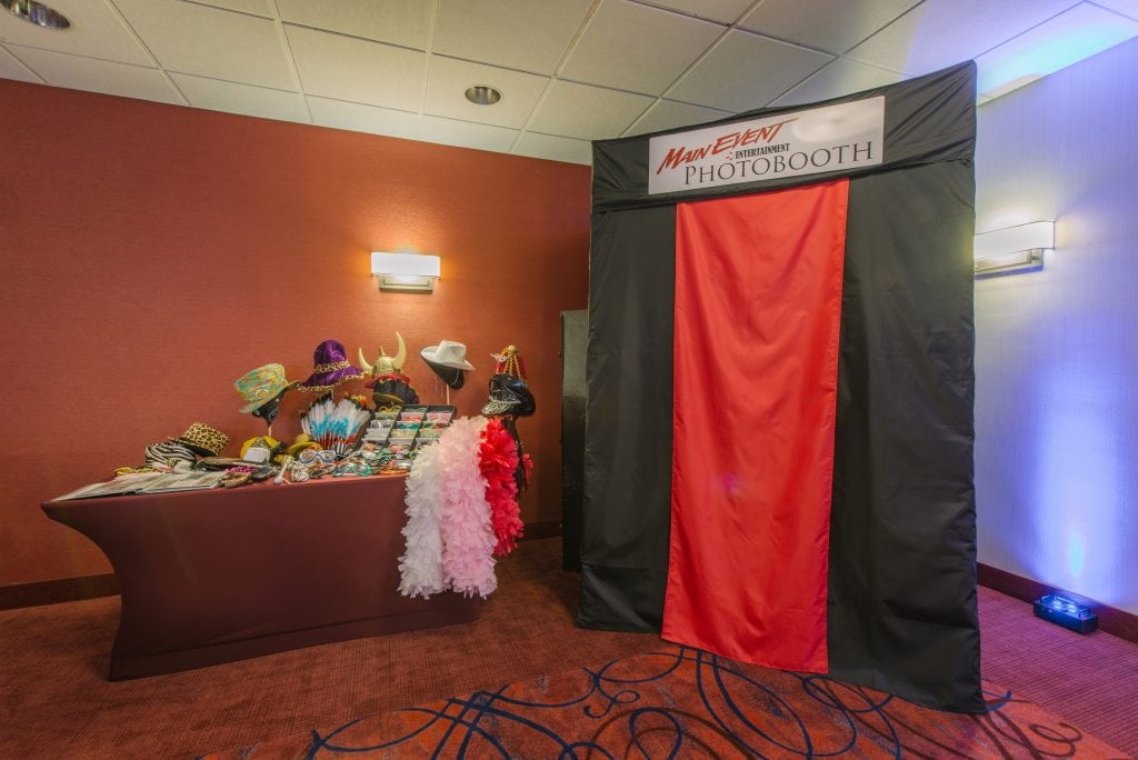 Main Event's PhotoBooth with props and a custom scrapbook